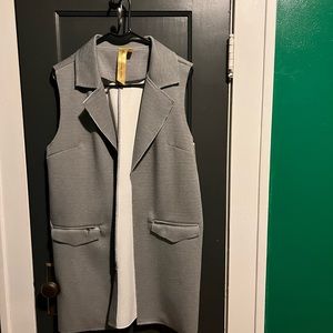 Gray sleeveless vest by There is a Star in Every Woman.